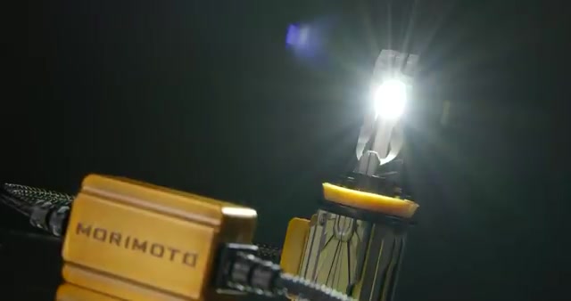 Morimoto 2Stroke LED bulb illuminated showing emitter output and driver module