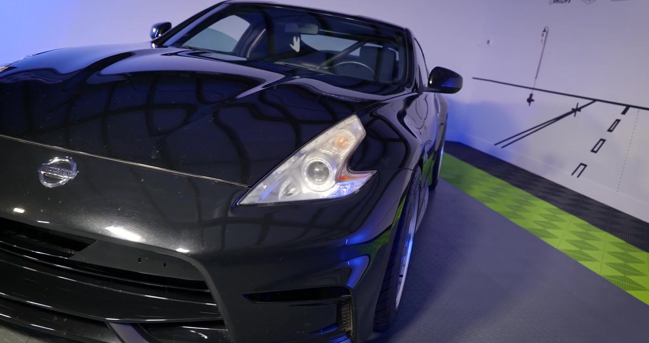 Before and after beam pattern comparison showing stock fresnel lens versus STi-R clear lens on 370Z headlight