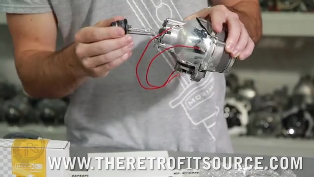 D2S HID bulb being removed from protective plastic cup