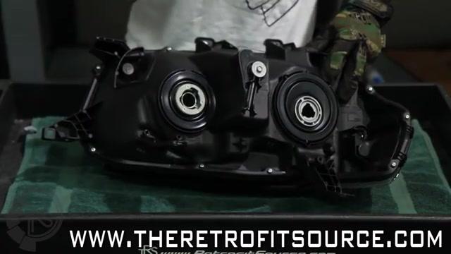 Removing screws around the edge of the headlight housing
